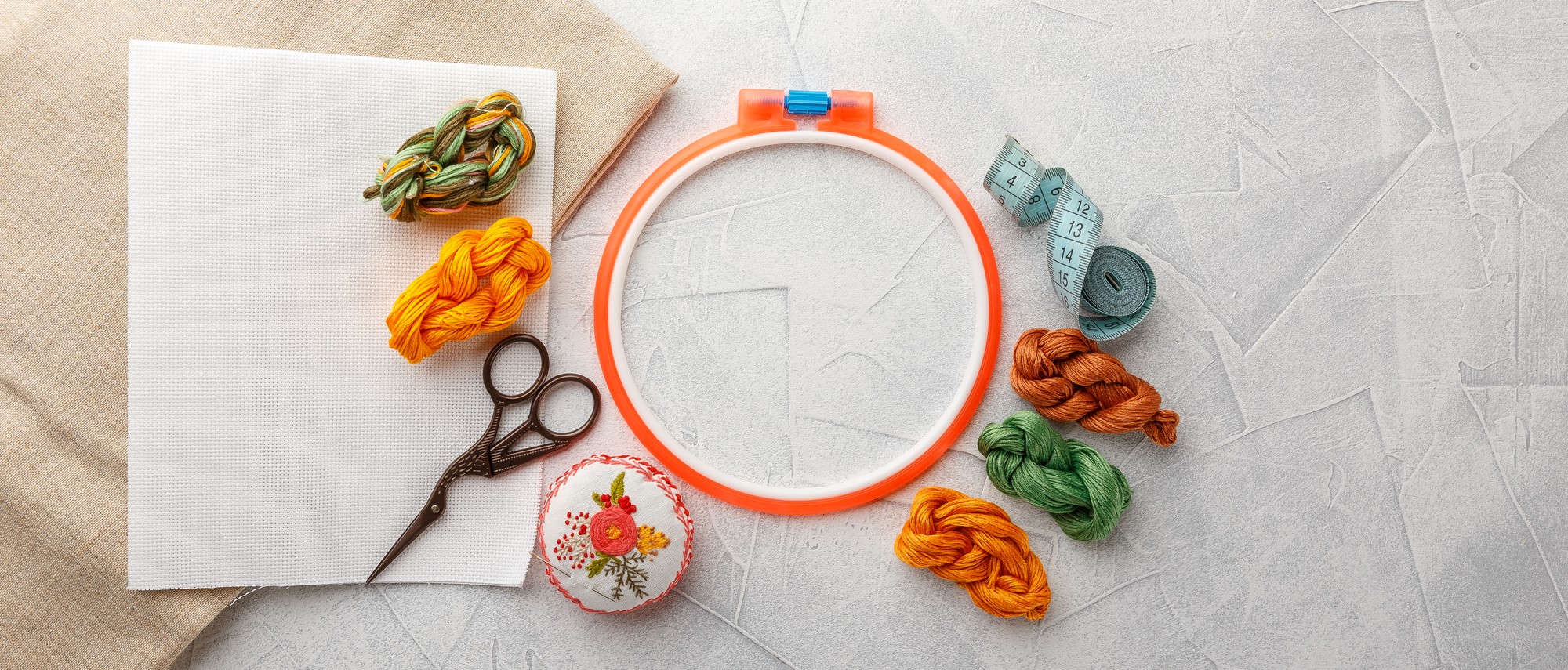 Workspace showing hoop, tablet and design file